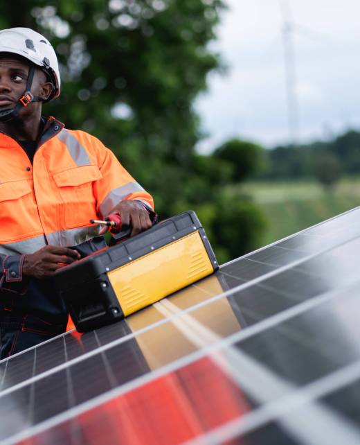 Service engineer inspects and maintains solar panels in a cultivation area, promoting clean energy.